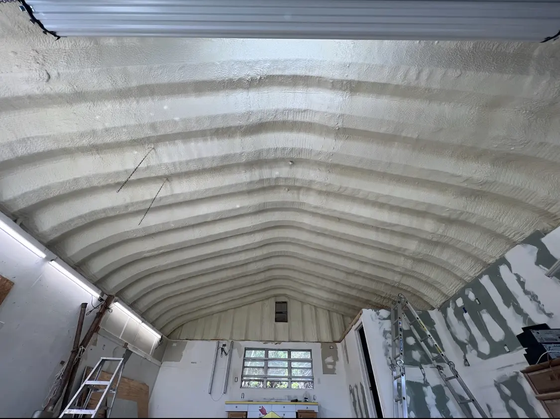 Spray polyurethane foam applied to the underside of a metal roof deck in Ephraim